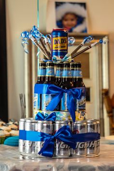 a cake made out of beer cans and blue ribbon