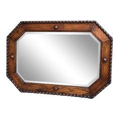 a wooden mirror hanging on the wall