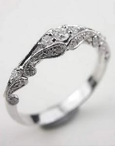 a white gold ring with diamonds on it