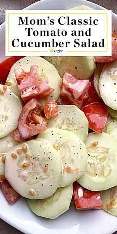 a white plate topped with cucumbers and ham