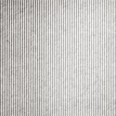 a white wall with vertical lines on it