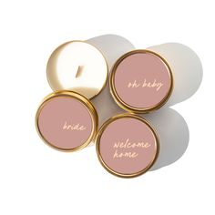 three pink and white candles with the words bride, welcome home written in gold on them