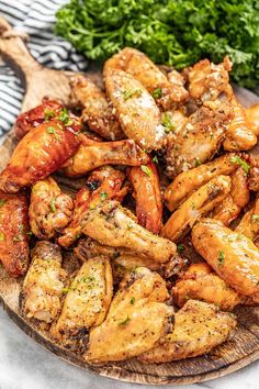 chicken wings and parsley on a wooden platter