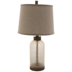 a table lamp with a brown shade on it and a light bulb in the middle