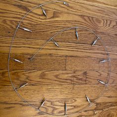 a circular metal object sitting on top of a wooden floor