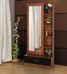 a tall wooden shelf with a mirror and vases on it next to a window