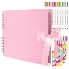 a pink binder with a bow on it