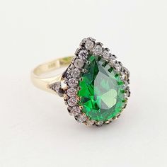 "14k Gold Hurrem Ring-Emerald Colored Zircon Stone Ottoman Style Ring A great gift for women's day. This stunning Ottoman style ring is carefully handcrafted from 14 carat gold. * Crafted in solid 14k Yellow gold and stamped \"14K\" for authenticity. * It is 100% 14k gold. (We don't sell filled or plated jewelry) * The package includes a gold certificate. * It comes with its box, ready to be given as a gift. * Free Express International Shipping 14k gold does not oxidize or discolor, so you can Hurrem Ring, Gold Certificate, Ottoman Styling, Great Gifts For Women, Ring Emerald, Stackable Rings, Jewelry Plate, Ladies Day, Ring Gift