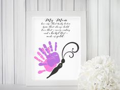 a pink and purple hand print with the words, my mom