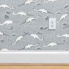 a light switch cover that has some animals on it and is next to a wall