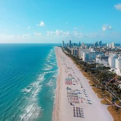 an aerial view of the beach and ocean in miami, with hotels on either side