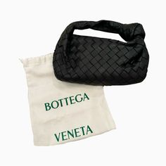 Bottega Veneta Mini Jodie Bag Black Excellent Condition - Only Worn Once! Top Handle Bag In Lambskin Leather With Soft Rounded Shape And Signature Knot Made Using Intrecciato Craftsmanship Mini Intrecciato Leather Top Handle Bag Single Compartment Zipper Closure Comes With Original Dustbag Material: 100% Lambskin Lining: Calfskin Color: Black Hardware: Gold Finish Height: 23 Cm | 9.1" Width: 28 Cm | 11" Depth: 8 Cm | 3.15" Handle Drop: 10 Cm | 3.9" Made In: Italy ***Do Not Bundle Listings Priced At $500 And Over - Sale Will Be Cancelled*** High-end Black Pouch Bag, Luxury Clutch Bag For Errands, Luxury Handheld Pouch For Shopping, Luxury Handheld Shopping Pouch, Designer Black Handheld Baguette Bag, Designer Black Baguette Bag For Travel, Designer Black Shoulder Bag Pouch, Luxury Black Satchel Pouch, Designer Black Top Handle Pouch