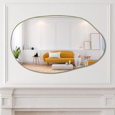 a living room with white walls and a yellow couch in front of a mirror on the wall