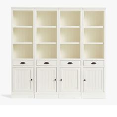 a white bookcase with three doors and two drawers