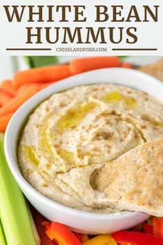 white bean hummus in a bowl with carrots and celery on the side