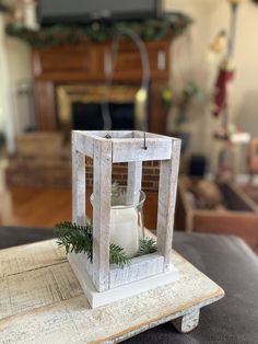 a candle holder sitting on top of a wooden table