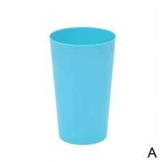 a blue cup sitting on top of a white table