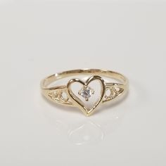 "Thanks for shopping our vintage estate store. We tend to sell well below wholesale and truly hope you enjoy all of our items. Many of the items are one of a kind, so please enjoy scrolling through the pictures and hopefully something will catch your eye. Brown spots are from camera. Estate 10k yellow gold .04ct cz diamond heart ring. Ring size: 6.75 CZ Diamond: .04ct Setting: 8mm 3/8\" Band width: 1mm Weight: 1.01 grams Very sweet ring. Marked 10k." Vintage 14k Gold Heart Shaped Rings, Rings Vintage, Vintage Yellow Gold Heart Cut Ring, Vintage Yellow Gold Heart Ring For Formal Occasion, Vintage Gold Heart Ring Hallmarked, Vintage 14k Gold Heart-shaped Rings, Diamond Heart Ring, Jewelry Accessories Ideas, Classy Jewelry