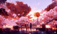 two people standing in front of a tree with pink flowers on it at sunset or dawn