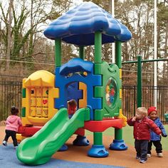 children playing in a play area at a park