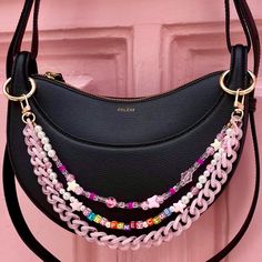 👜 Want to make your handbag unique? Discover my handmade bag chains from Paris, the perfect accessory to add style and personality to your look. Turn your handbag into a jewel with a touch of Chappell Roan! With a practical clasp and ring options, my chains easily attach to almost any bag. ❣️ First Lodzé bag chain? ❣️ For handles where clasps don't fit, don't forget to select the clip rings 7). * Features: Trio of beaded and acrylic chains: Fancy bead chain: 34cm/13.38" Message chain: 36cm/14.1 Pink Chain Bag For Gift, Pink Bag Charm Keychain For Everyday Use, Handmade Pink Bag For Personal Use, Pink Shoulder Bag With Chain Strap For Gift, Pink Shoulder Bag With Chain Strap As Gift, Pink Bags With Chain Strap As Gift, Pink Bags With Chain Strap For Gifts, Pink Bag With Chain Strap As Gift, Junk Purse