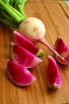 radishes and asparagus on a cutting board