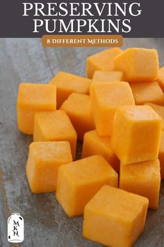 several cubes of buttered pumpkin sitting on top of a cutting board with text overlay that reads, how to preserve and preserve preserving pumpkins