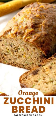 an orange zucchini bread is cut in half and sitting on a white plate