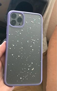 someone is holding up their phone case with stars on it in front of the camera