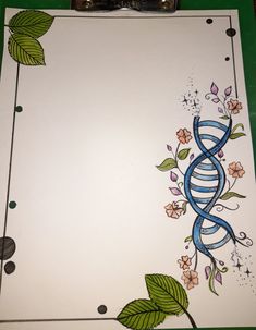 an image of a paper with flowers and a spiral design on it that is being colored