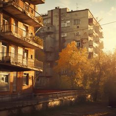 an old building with balconies and trees in the foreground