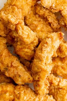 fried chicken sticks on a white plate ready to be eaten and served for lunch or dinner