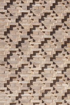 a brick wall that is made up of small bricks