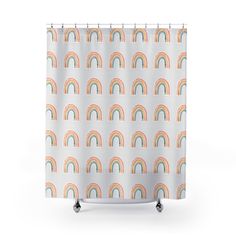 a shower curtain with rainbows on it