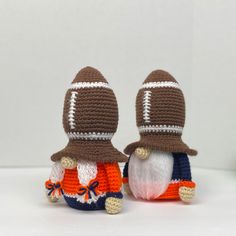 two small crocheted gnomes wearing hats