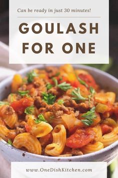 a white bowl filled with pasta and meat next to the words goulash for one