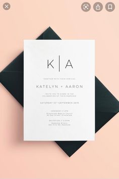 a black and white wedding card with the letter kla on it's front