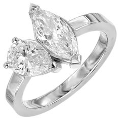 two pear shaped diamond engagement rings in white gold