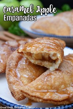 caramel apple empanadas on a plate with cinnamon sticks