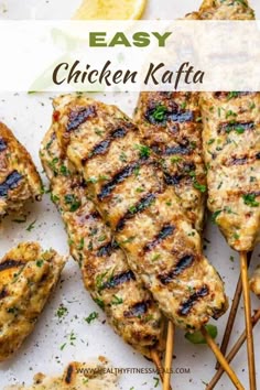 grilled chicken kafta on skewers with lemon wedges and parsley