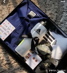 an open suitcase containing personal items for someone's birthday