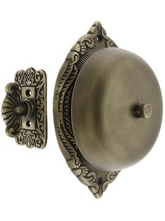 an antique style door handle and knob on a white background