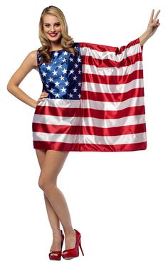 a woman is holding an american flag in her hands and posing for the camera with one hand