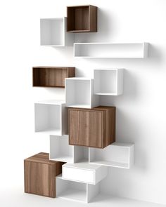 several white and brown cubes are stacked on top of each other in the shape of bookshelves