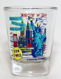 a shot glass with the statue of liberty and new york on it's side