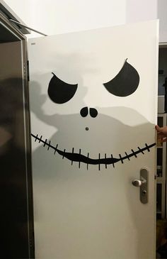 a white refrigerator with the face of jack skellingy on it's side