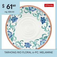 a blue and white plate with flowers on it, $ 6 00 reg $ 8 00