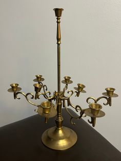 an antique brass candelabra with eight candles