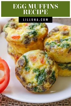 egg muffins on a white plate with tomatoes