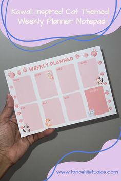 a person holding up a pink planner with cats on it and the words kawaii inspired cat themed weekly planner notpadd